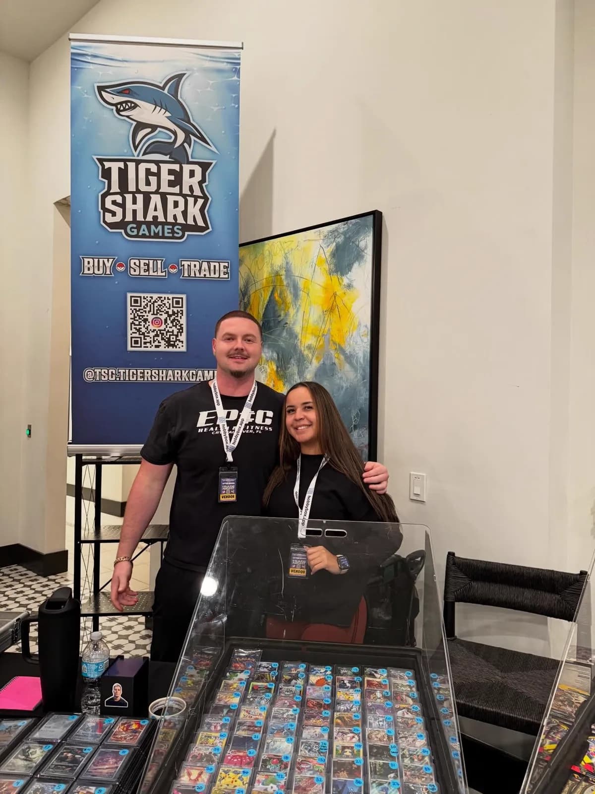 Tiger Shark Games booth with showcase cases of cards